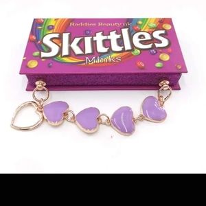 Skittles eyelash holder with a pair of lashes